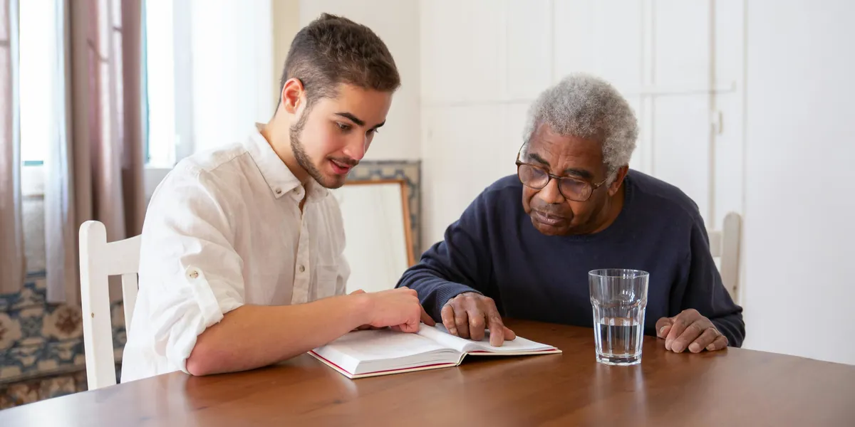 Young Man assiting a senior